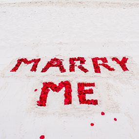 Rose petal letters in the sand Rose petal letters in the sand